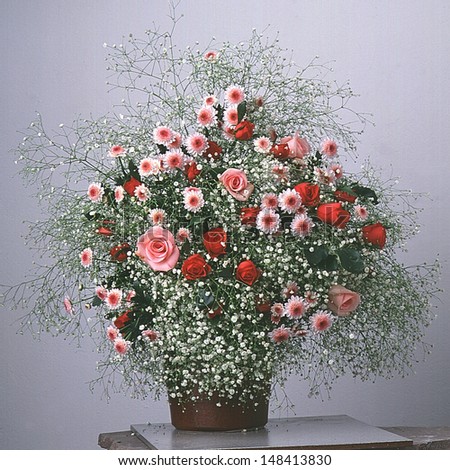 white / red flowers bouquet in vase