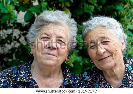 stock photo Portrait of two smiling and happy old ladies