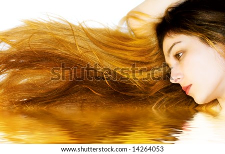 Woman with amazing long hair, reflecting in water
