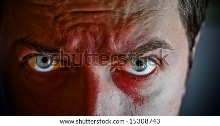 Close-up on criminal with blood on his face