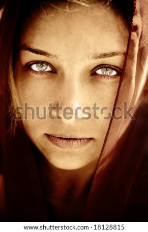 Portrait of mysterious woman with stunning eyes