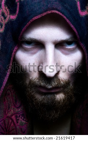 stock photo Portrait of mysterious scary man with evil look on his face