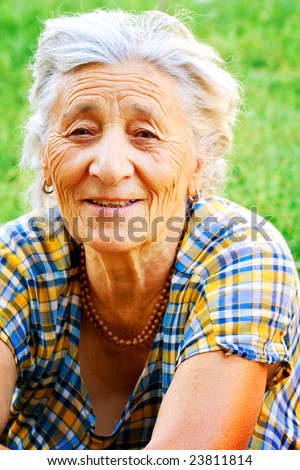 Outdoor portrait of happy senior woman