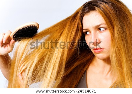 Portrait of annoyed woman with hair problem