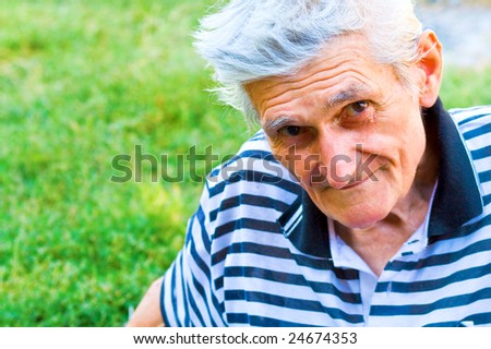 Outdoor portrait of one confident senior man