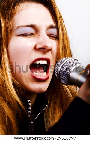 Rock music singer - blond woman with microphone