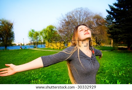 Happy and free young beautiful blond woman