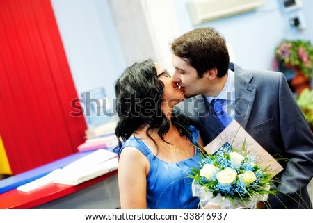 Happy just married couple kissing with love