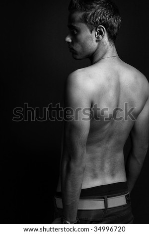 Back of masculine sexy shirtless thin man