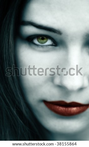 Spooky gothic woman with pale face and red lips