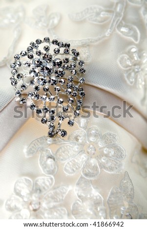 stock photo Silver brooch on luxury vintage wedding dress