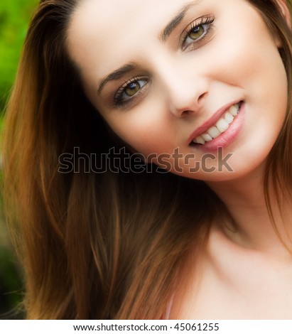 Candid portrait of happy young woman outdoor