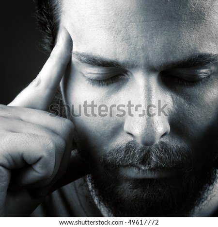Man expressing headache or think meditation concept