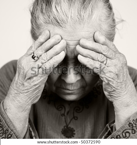 Unhappy old senior woman with health problems