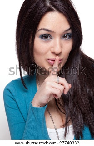 Cute funny young woman keeping a secret
