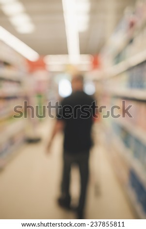 Shopping in supermarket. Shopping cart. Blur