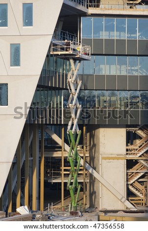 Worker on a Scissor Lift at a construction site