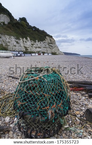 Pebbled beach with Lobster Pot at Beer, Devon, England, United Kingdom.
