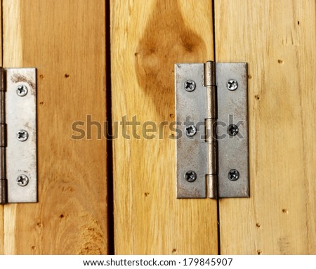 Rust hinge on wooden door, Close up of a metal door rust hinge