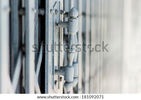 Close-up of an old steel door handles  and door, old steel handles folding doors background