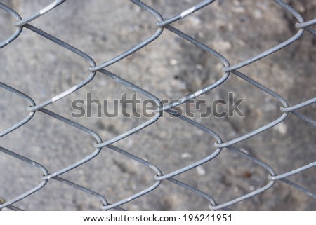 Old iron wire fence, close-up wire mesh fence