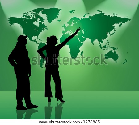 Two people standing in front of world map