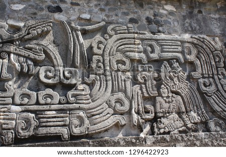 Bas-relief carving with of a american indian chieftain and god Quetzalcoatl, pre-Columbian Maya civilization, Temple of the Feathered Serpent in Xochicalco, Mexico. UNESCO world heritage site
