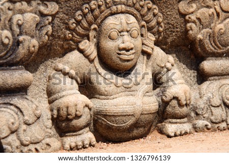 Bahirawa stone carving with ancient guardian of moonstone steps, Mahasena Palace ruins, Anuradhapura, Sri Lanka. UNESCO world hwritage site