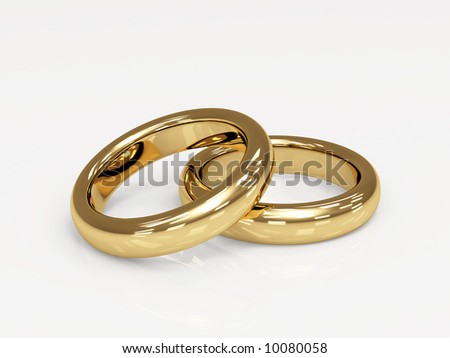 stock photo Two 3d gold wedding ring laying on a glossy surface