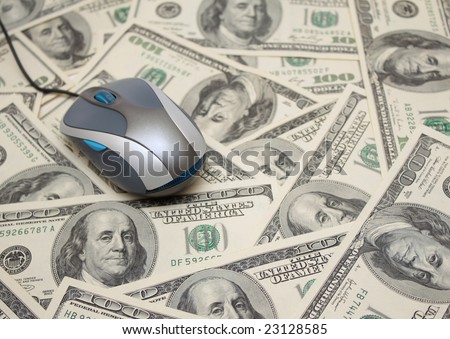 E-commerce - computer mouse and dollars
