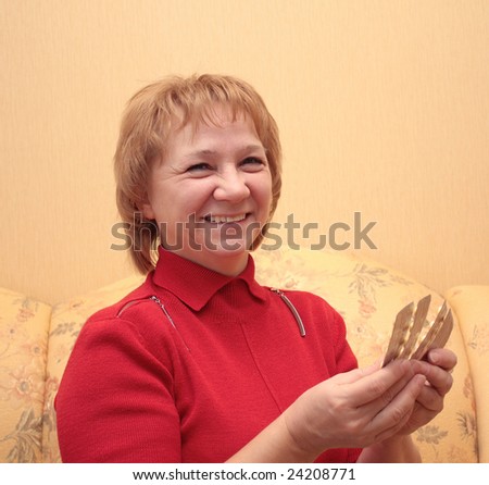 Elderly woman choosing a medicine