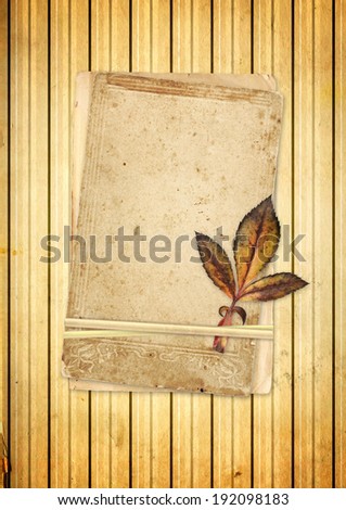 Old cards and dry leaf on old paper