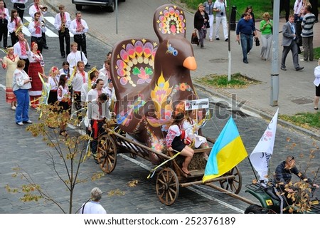 KIEV, UKRAINE - AUGUST 24: People in national costumes and the wonderwork-bird at the All Ukrainian Vyshyvanka Parade on Maidan at Independence Day on August 24, 2013 in Kiev, Ukraine.