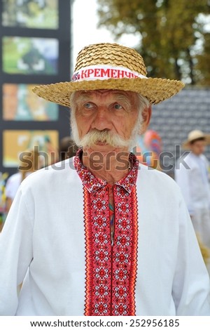 KIEV, UKRAINE - AUGUST 24: An old man with whiskers on his face in a straw hat and in national costume at All Ukrainian Vyshyvanka Parade at Independence Day on August 24, 2013 in Kiev, Ukraine