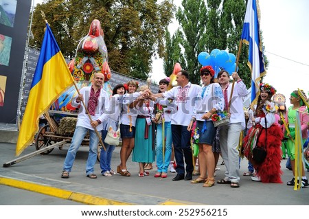 KIEV, UKRAINE - AUGUST 24: People making photos with a wonderwork-bird - a symbol and work of art each of the ukrainian regions specially made for All Ukrainian Vyshyvanka Parade at Independence Day