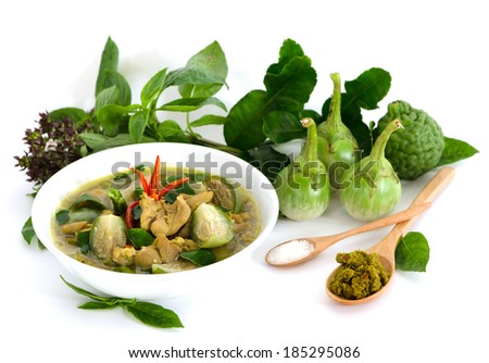 Curry Chicken in Bowls , Spices, curry paste, sugar, herbs and vegetables laid out on a white background.