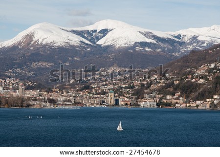 Lugano lake panorama during the winter with mountains and snow