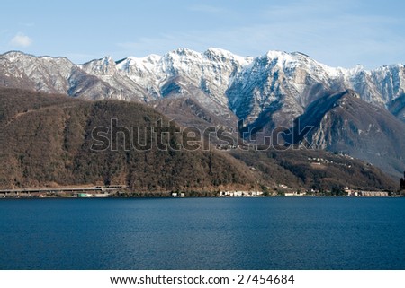 Lugano lake panorama during the winter with mountains and snow