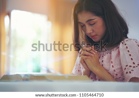 woman hands praying to god with the bible. Woman Pray for god blessing to wishing have a better life. begging for forgiveness and believe in goodness. Christian life crisis prayer to god.