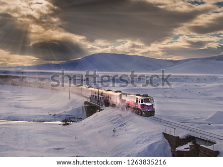 Kars, Turkey - January, 2018: Ankara-Kars (Diesel Train) Eastern Express train in the winter with sunrise. The travel of Eastern Express (Dogu Ekspresi) takes 24 hours between Ankara and Kars.
