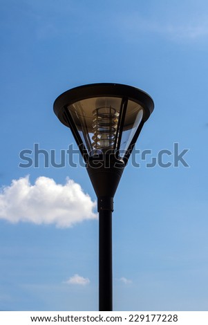 Close up of outdoor lamp with blue sky
