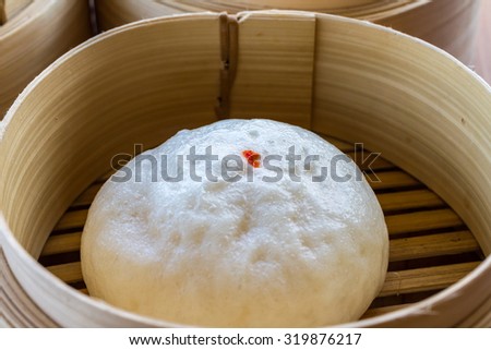 steamed dumpling, steamed stuff bun in stream basket