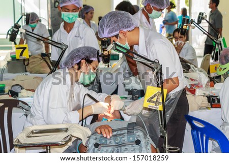 CHONBURI - OCTOBER 2 : Unidentified dentist from public hospital are in medical services  at wat yansangwararam temple on October 2,2013 in  Chonburi,Thailand.