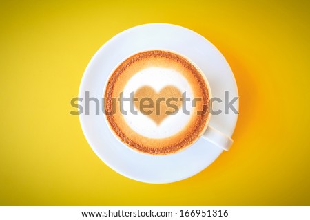 Cup of coffee,heart drawing on coffee