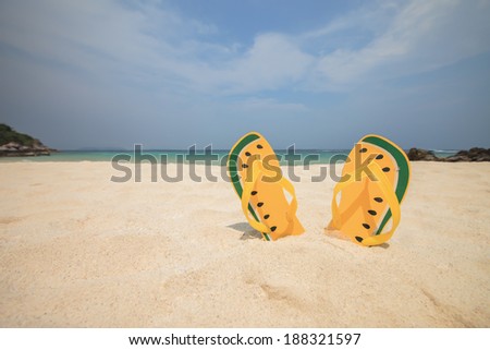 Shoes on sea sand