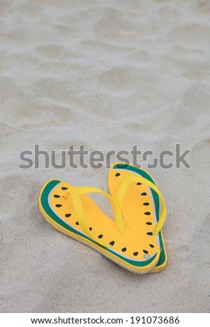 Shoes on sea sand