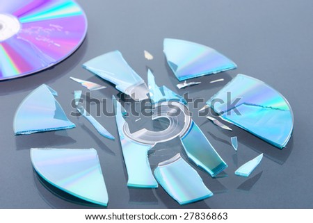 A broken disk into pieces and the damaged one that not in focus.