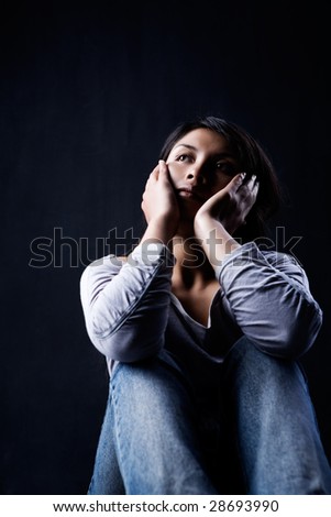 Portrait of woman contemplating in dark