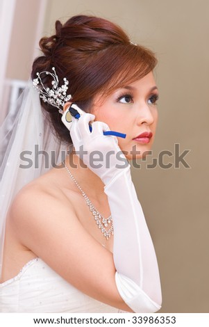 A bride to be is calling on her cellphone