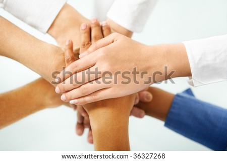 multi color hand of people hand in unity to express togetherness in community